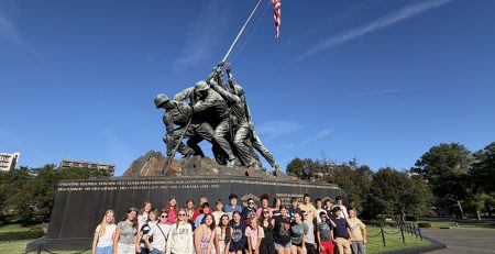 group of students posing for a photo in front of the Soldiers and Sailors Monument