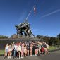 group of students posing for a photo in front of the Soldiers and Sailors Monument