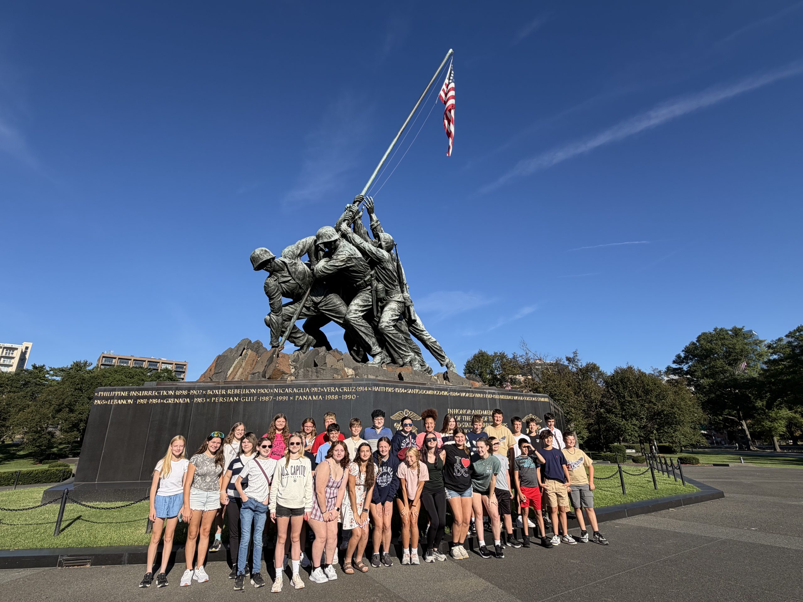 group of students posing for a photo in front of the Soldiers and Sailors Monument